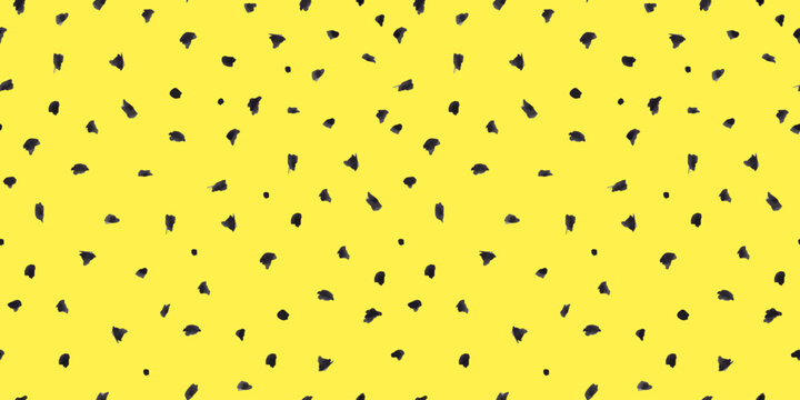 Dash pattern on yellow background. Wrapping paper with small black dots painted with a brush. Seamless simple minimal ornament. Abstract geometric grunge vector texture painted by ink.