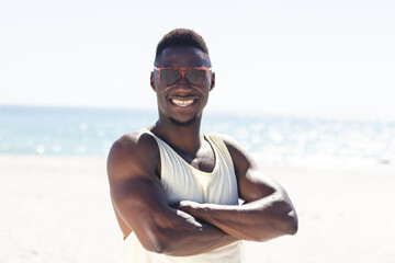 African American man smiles at the beach
