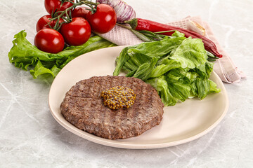 Frilled beef burger cutlet with iceberg