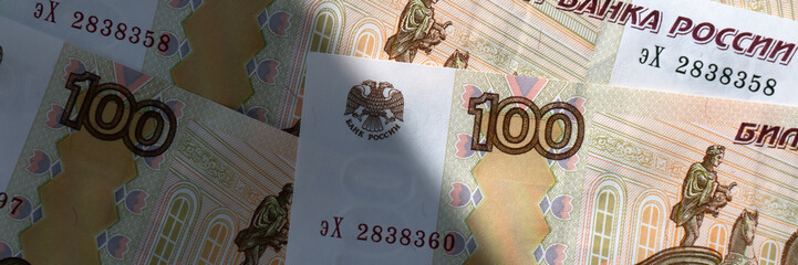 Close-up of Russian banknotes. A hundred-ruble bill. banner