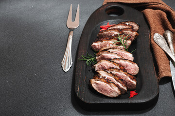 Fried duck breast with fresh orange and ginger, ready to eat food. Domestic cuisine, poultry meat