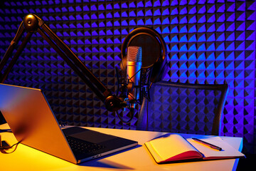 Home studio podcast interior. Microphone, table and chair