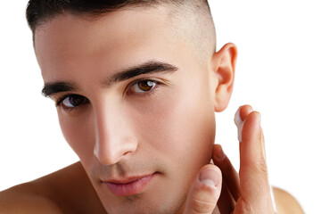 Young attractive brunet guy with perfect skin touching chin on white background