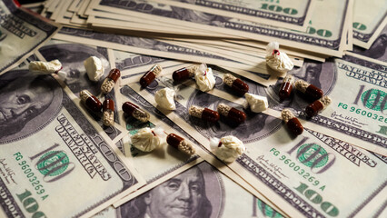 Criminal money from the sale of drugs. Bookmarks of cocaine and pills. Close-up. Stop drugs.	 - obrazy, fototapety, plakaty