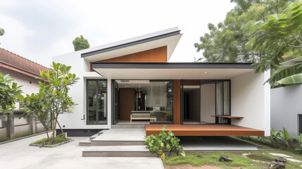 Fototapeta premium Embracing the less is more mentality this minimalist house maximizes space with smart storage solutions and a neutral color palette.