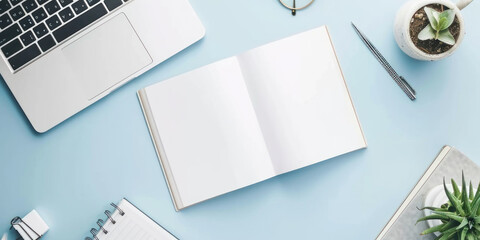 top view white book and accounting on a minimal clean light blue desk with laptop