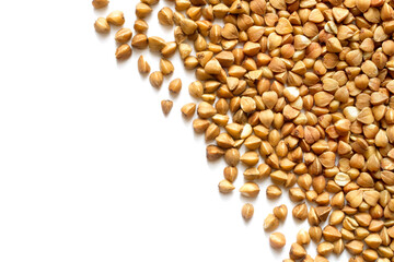 Raw buckwheat on a white background. Buckwheat close-up.