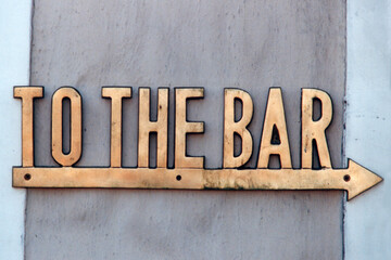 TO THE BAR direction sign
