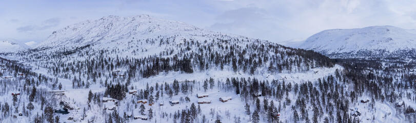 Early morning winter panorama at mjolfjell valley in southern norway, sun rising above the...