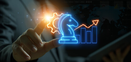 Businessman pointing his finger for showing knight chess looking forward with fire gear and bar chart that have arrow up on top. Concept for business strategic growth, vision and mission.