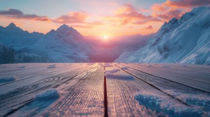 Empty wooden floor against the backdrop of Snowy Mountain with sunset