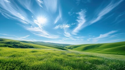 Idyllic Rolling Green Hills Under a Clear Blue Sky with Wispy Clouds. - obrazy, fototapety, plakaty