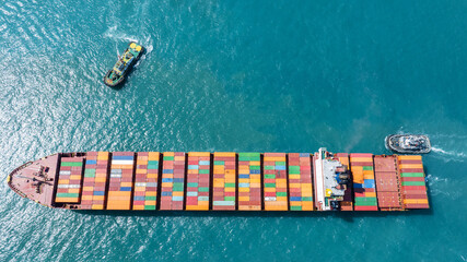 Cargo Container Ship was pulling by Tugboat. container ship import export to customers sea port....
