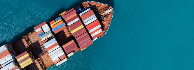 Top view Cargo Container ship in the ocean ship carrying container and running for import export...