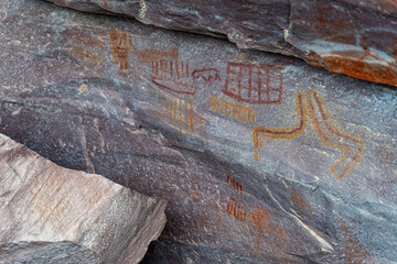 Ancient Petroglyphs Carved on Rocky Surface Revealed