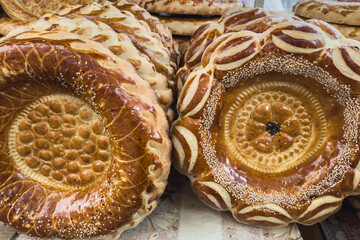 Traditional Central Asian flatbreads at a market stall in Bishkek. Everyday Kyrgyz food. With fresh...