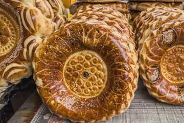 Traditional Central Asian flatbreads at a market stall in Bishkek. Everyday Kyrgyz food. With fresh...
