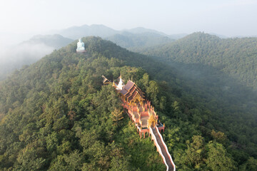 Aerial view of Wat Prathat Doi Prachan and Great Buddha at Doi Phra Chan is a towering bronze...