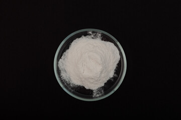 Sodium Carboxymethyl Cellulose, NaCMC in Petri dish. Food additive E466. Carboxymethylcellulose,...