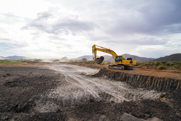 construction machines at works, dozer, roller machine, excavator, crawler rock drill machine, trucks, GPS grader