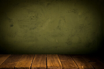Empty table on dark green texture wall background. Composition with monstera leaves shadow on the wall and light reflections. Mock up for presentation, branding products, cosmetics food or jewelry