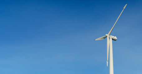 Fototapeta premium Wind energy and technology. Wind renewable resources and eco technologies. Green energy concept