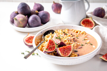 Healthy breakfast bowl with granola and figs