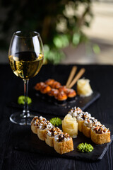 rolls with a glass of white wine