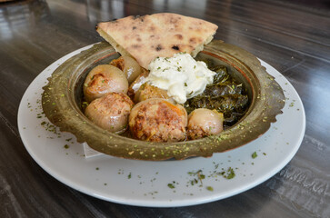 Sogan dolma Bosnian dish. Stuffed onion and wine leaf with meat.