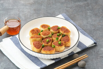 Gohyong or Ngo Hiang, made from minced chicken with flour, served with sour sauce
