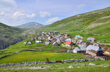 Fototapeta na wymiar Mountain village Lukomir in Bosnia and Herzegovina. Unique and traditional village. Unique village in Europe. Medieval traditional way of living. Rural tourism and holidays.