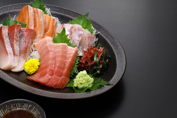 assorted sashimi; tuna(medium fatty), salmon, yellowtail, and sea bream. authentic Japanese dining. copy space.