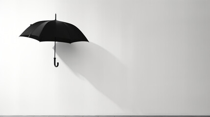 A black and white umbrella hanging on a wall.