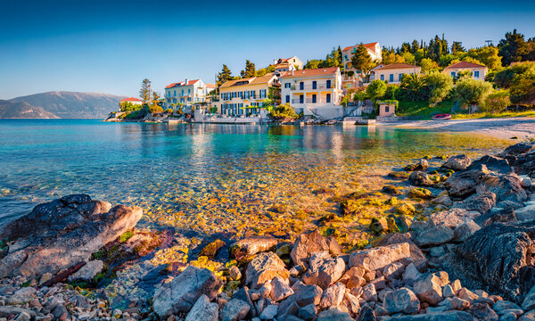 Splendid summer cityscape of Fiskardo town with Zavalata Beach. Attractive morning seascape of Ionian Sea. Spectacular outdoor scene of Kefalonia island, Greece, Europe. Traveling concept background.