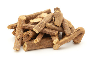 Close-up of Dry Organic Liquorice or Mulethi (Glycyrrhiza glabra), isolated on a white background. Front view