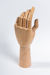 The wooden arm of a mannequin.