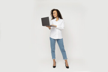Young attractive girl with laptop in hands