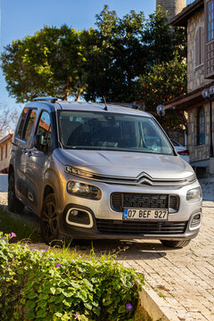 Side ; Turkey &ndash; February  04 2024:   islver Citroen Berlingo   is parking  on the street on a  summer day