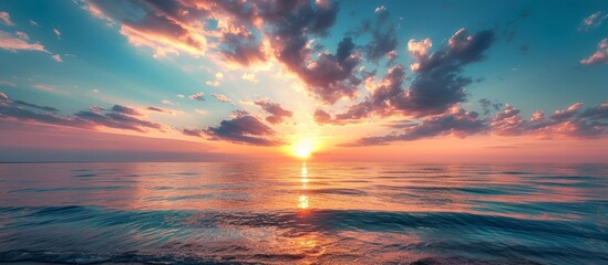 the sun is setting over the ocean . High quality - obrazy, fototapety, plakaty