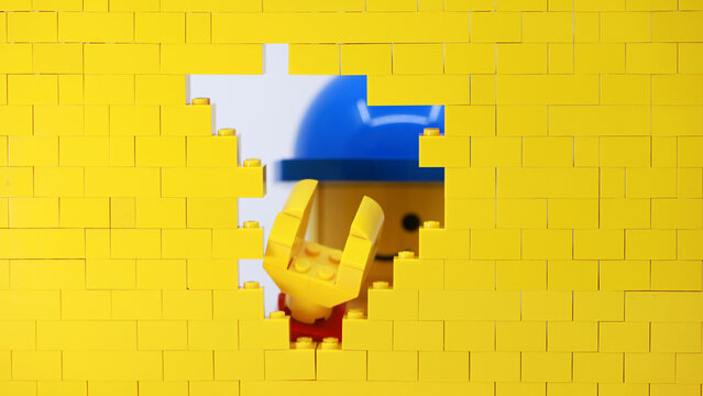 Hong Kong -February 15 2024: a giant man make a punch and break the wall