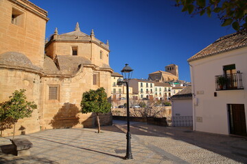 The external facade of Carmen church (on the left) in Alhama de Granada, Granada province,...
