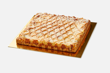 Delicious galette with four types of cheeses on golden serving cardboard
