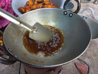 Dry tarmerik salt masala fish fry is a simple tasty delicious and flavourful fish fry in Aluminum pot,Hot Fried Fish on a Almuniyam container with Hot Oil,Hot bubbly and so delicious Fish
