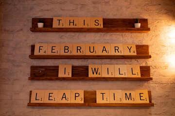 February 2024 Leap Year slogan on giant wooden letters, scrabble style letter pieces