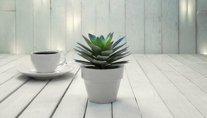 green potted plant on white wooden background