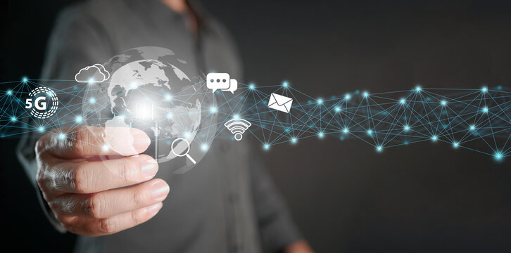 Global internet connection. Online digital data usage worldwide. Hand holds thumb drive with internet icons linked or connected to global electronics datum in business and technology.