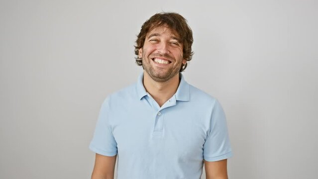 Hilarious young caucasian man puffing cheeks, making a crazy-fun face, inflated mouth full of air, catching breath over an isolated white background.