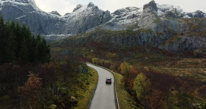 Autumnal Journey Through Lofoten: A Road Carving through Norway's Mountainous Majesty