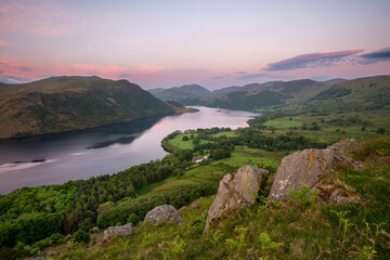 Purple sky on calm morning looking over Ullswater from Gowbarrow Fell in The Lake District, UK. - 736991251