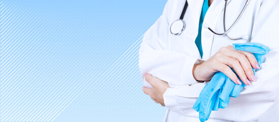 Healthcare and medical concept. A doctor with a stethoscope in his hand, in a white coat and blue...